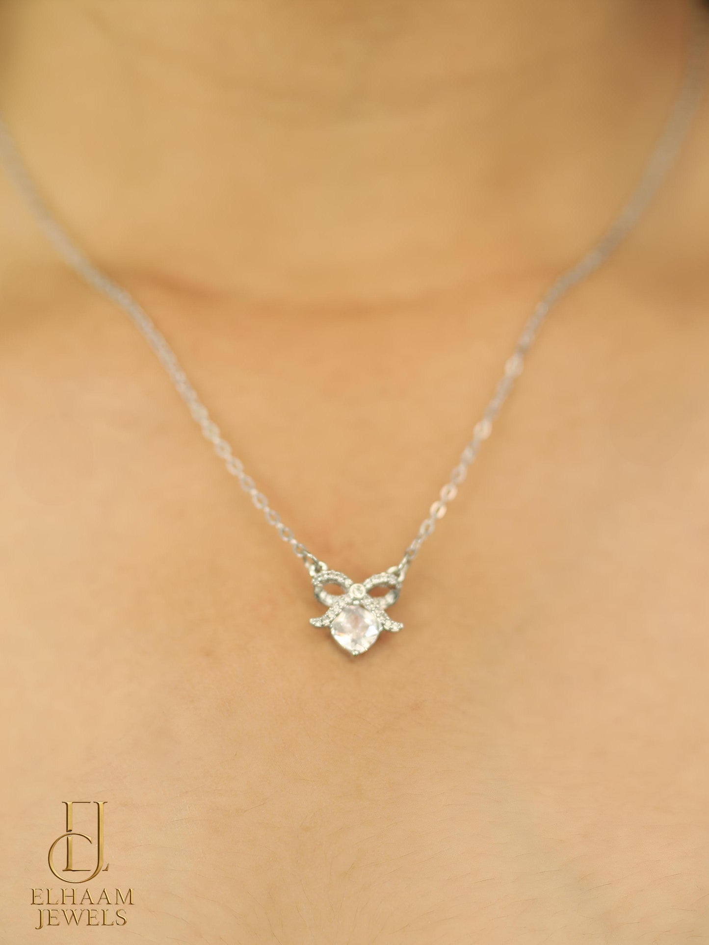Silver Bowknot Crystal Pendant Necklace by Elhaam Jewels